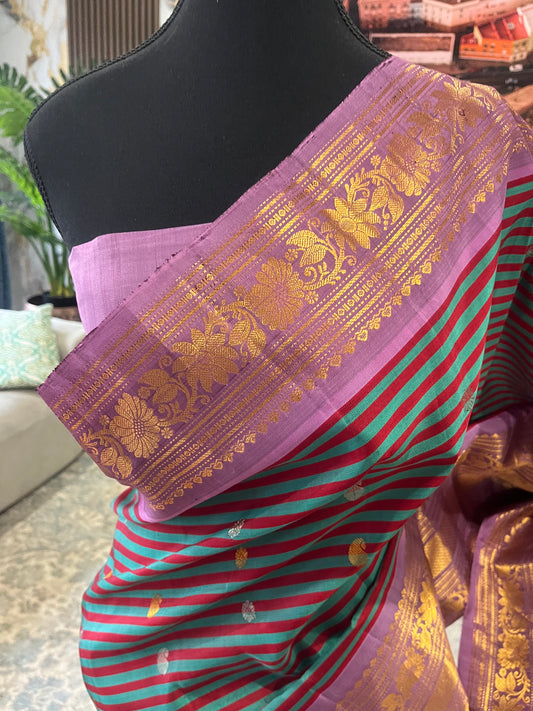 Tanirika (ತನಿರಿಕಾ) – Maroon & Ram Green Stripes with Lavender Pink Gadwal Pure Silk Saree